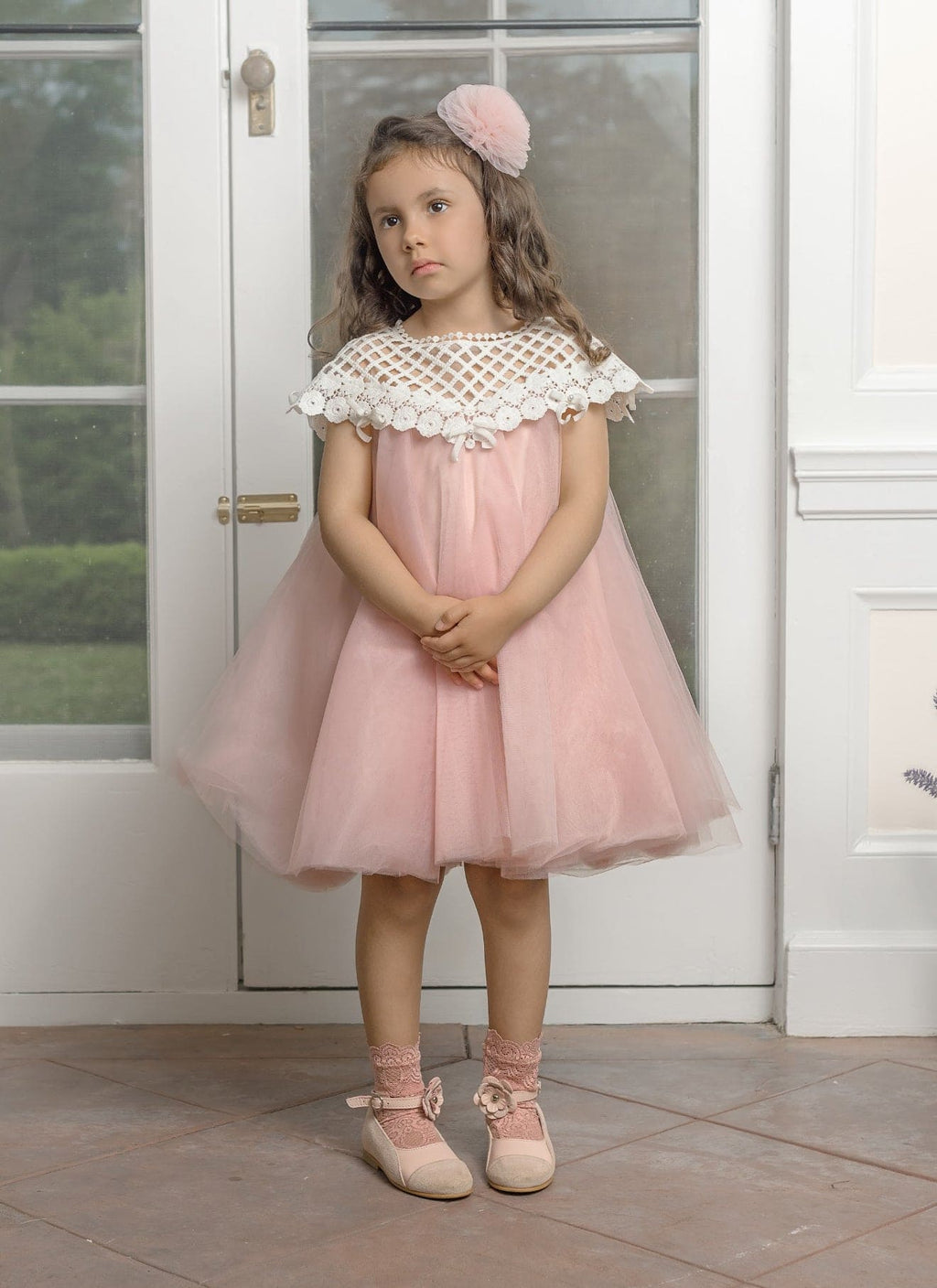 Girl wearing Rosa Pink Tulle Flower Hair Clip by Petite Maison kids