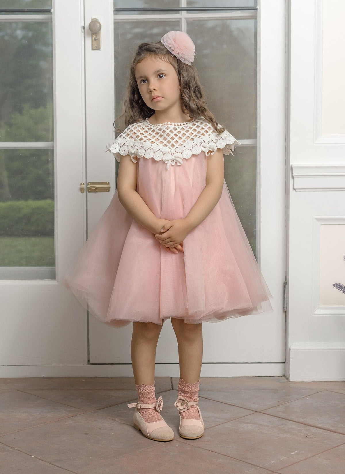 Girl wearing Rosa Pink Tulle Flower Hair Clip by Petite Maison kids
