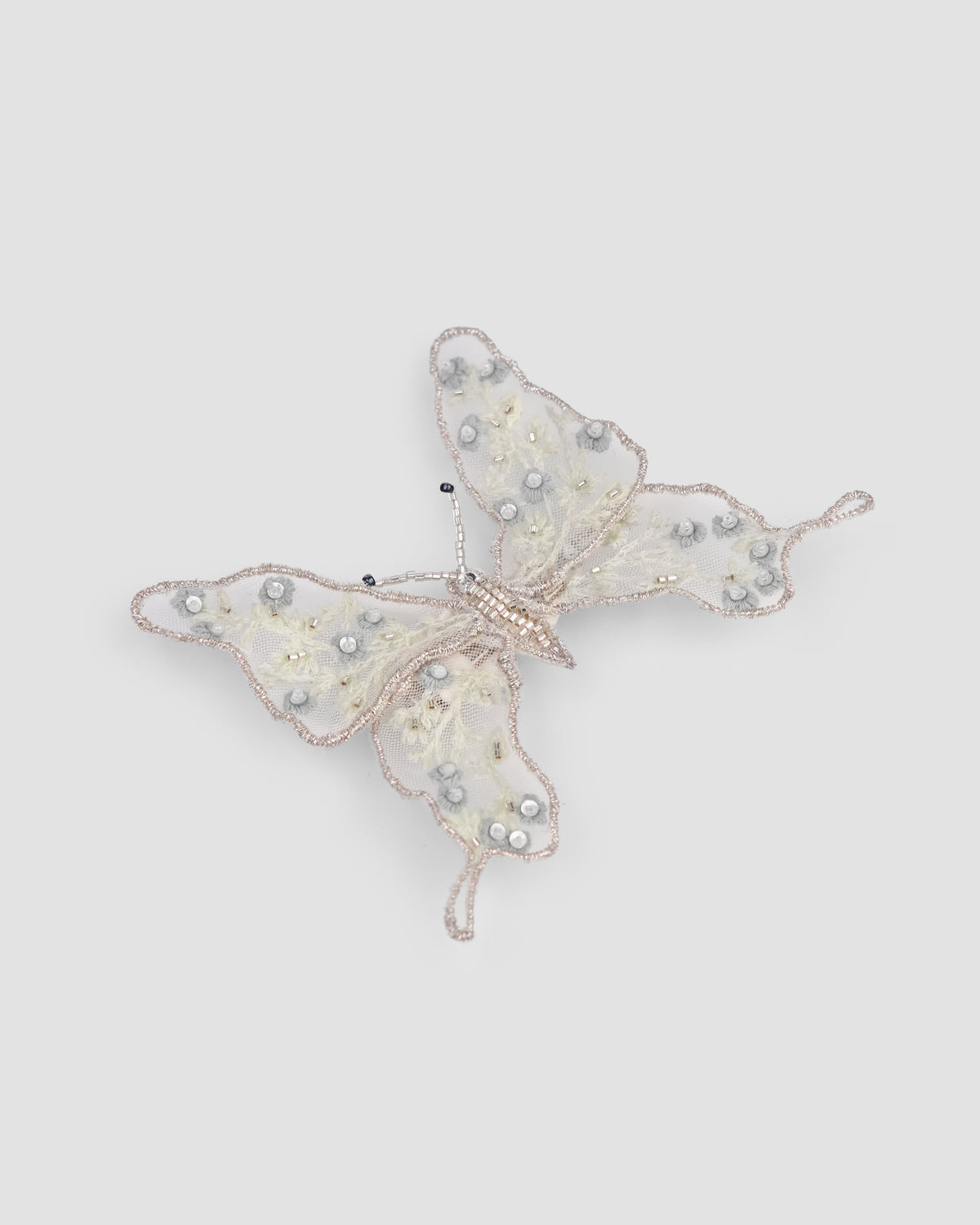 Girls butterfly hair clip with embroidered tulle wings, sequins and delicate bead details by House of Carousel