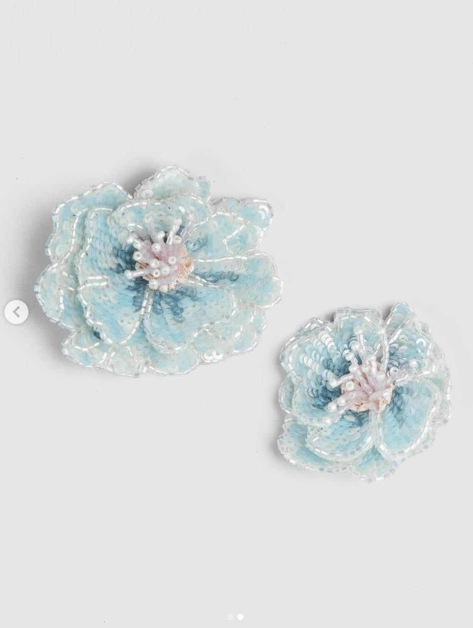 Soft blue rosette flower hair clips with dimensional layered petals and delicate beaded centres