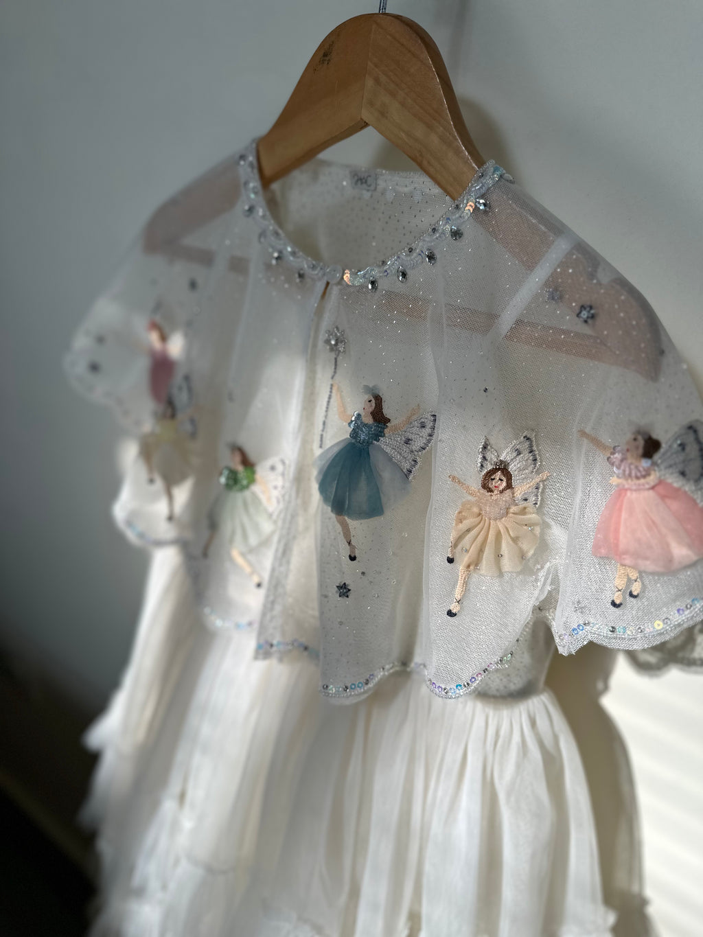 Fairies in the Starry Night dress featuring hand-appliquéd fairies and tulle cape by House of Carousel