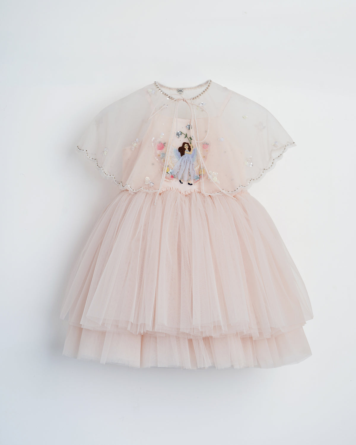 Fairy by Herself baby pink tulle dress with embroidered fairy and detachable cape by House of Carousel available at House of Aura