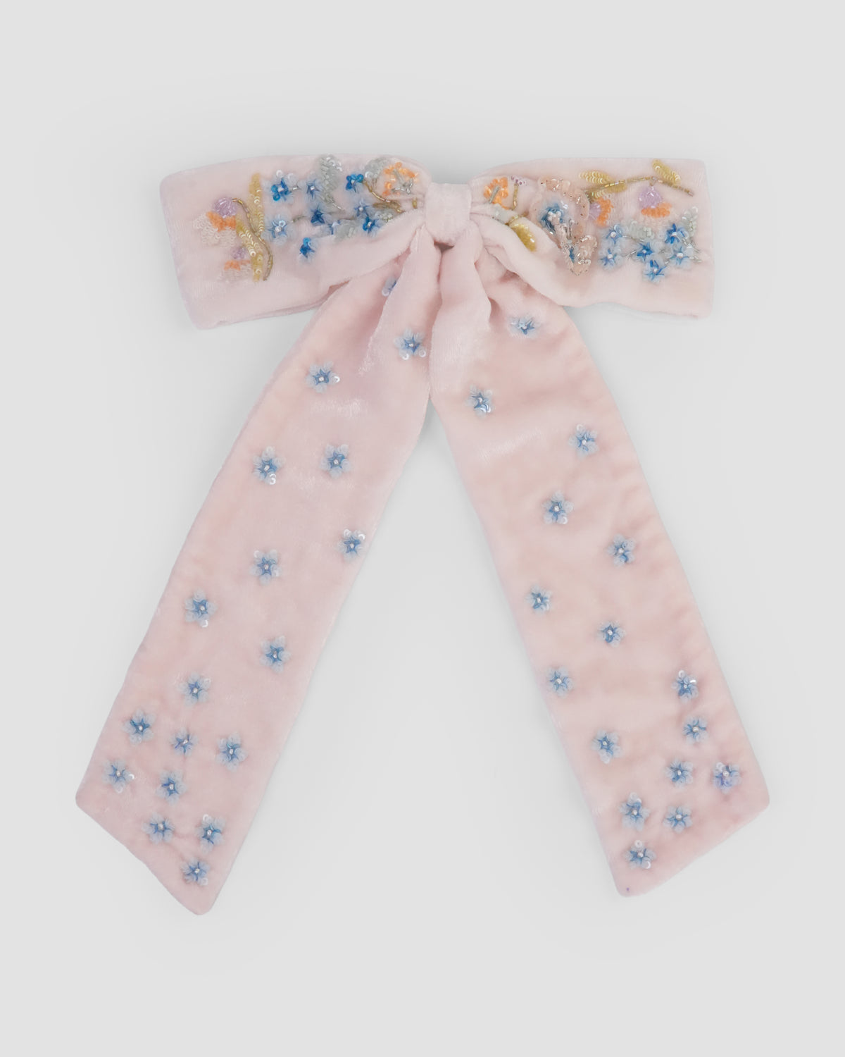 Fleur de Velvet Bow in baby pink velvet with hand-embroidered floral details by House of Carousel available at House of Aura