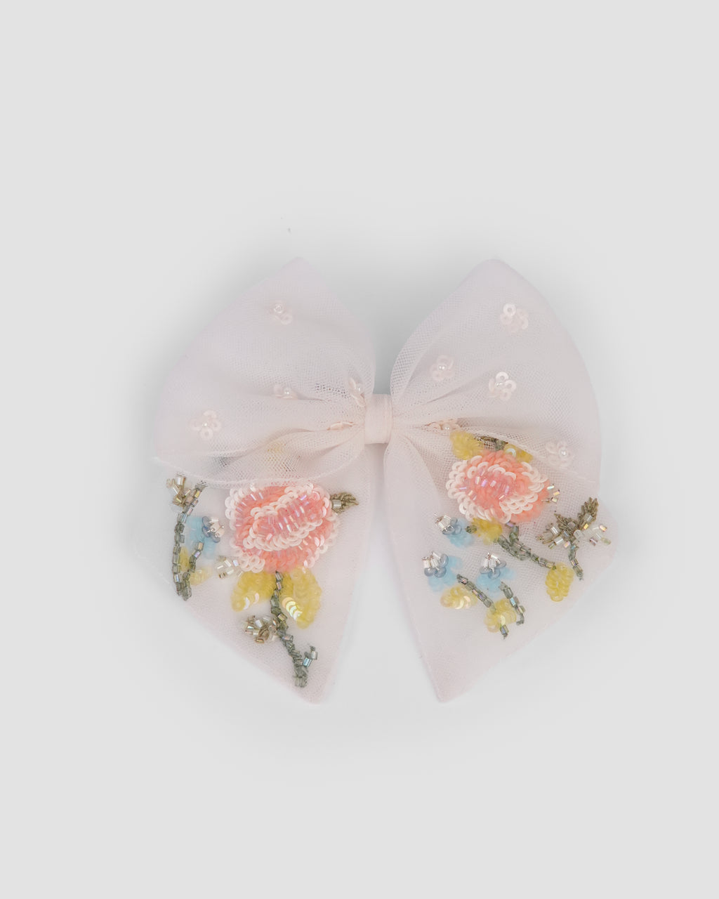 Floral Tulle Bow Clip in apricot tulle with hand-embroidered roses, sequins and beads by House of Carousel available at House of Aura