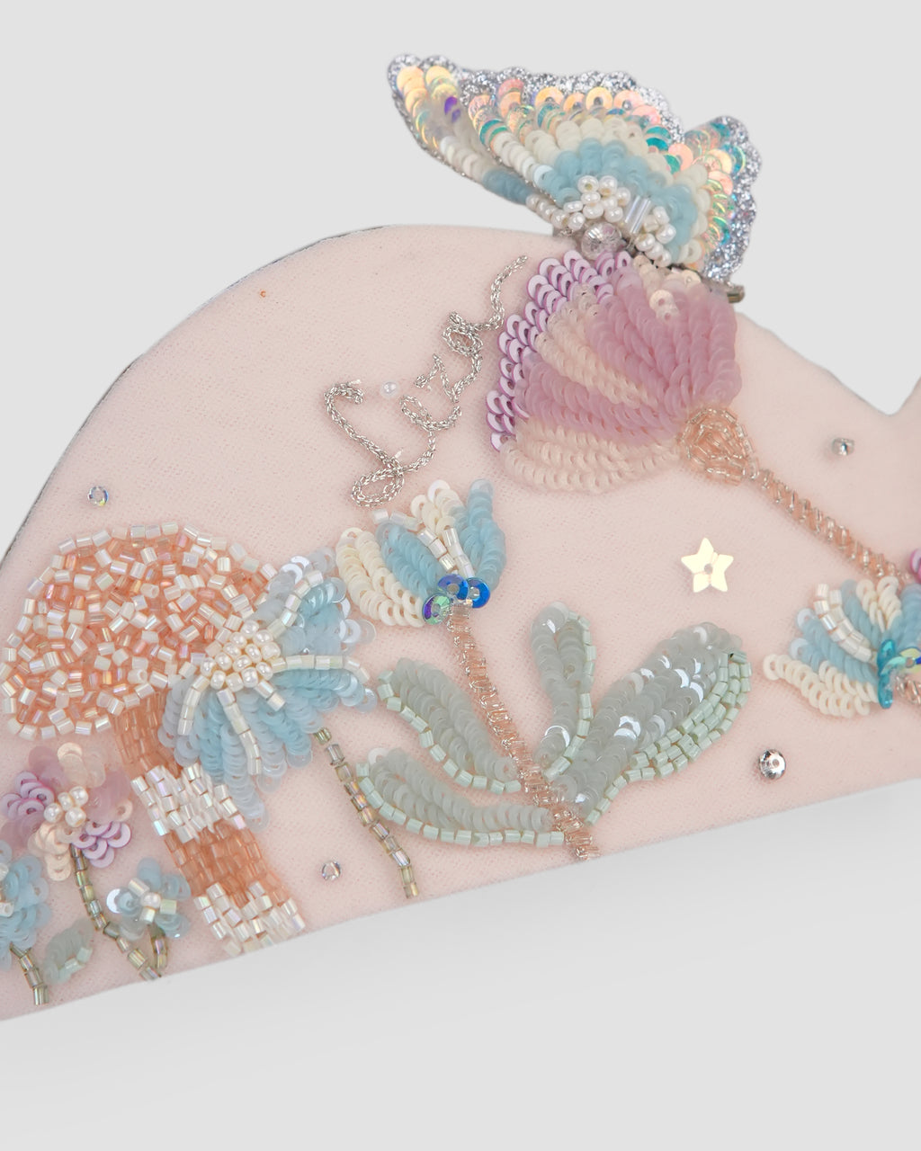 Close-up of pastel bunny and floral embroidery on the Hop in the Wild Crown