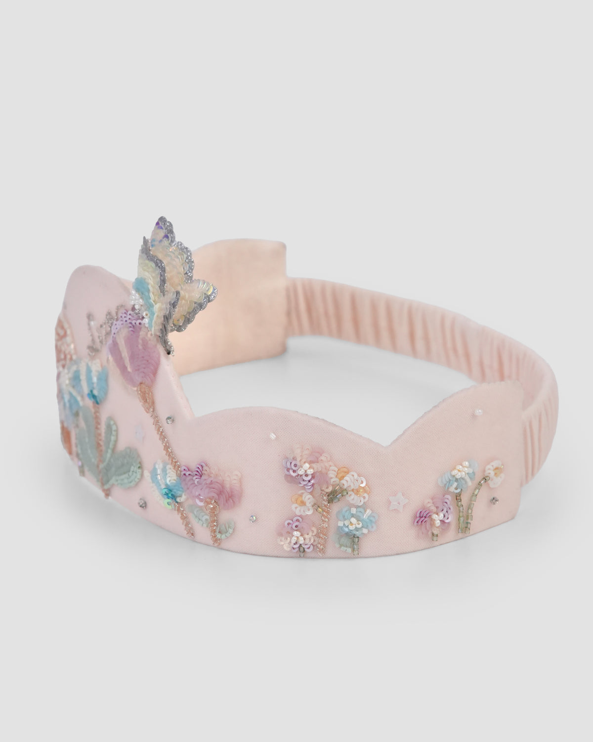 Side view of Hop in the Wild Crown with embroidered bunny garden details