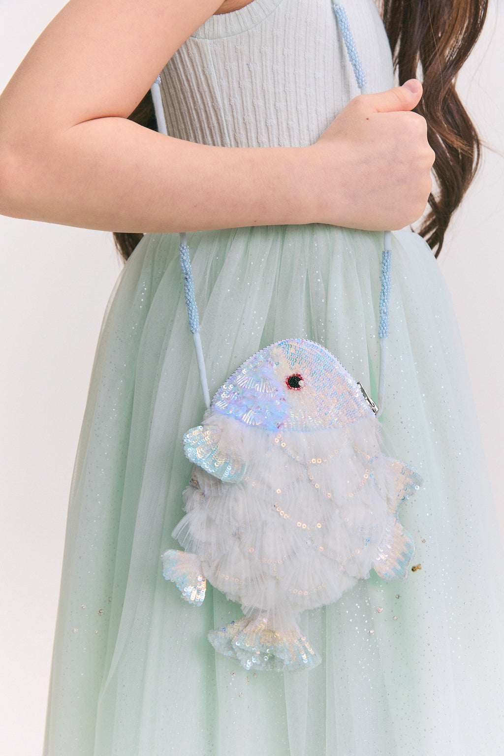 Fish-shaped crossbody bag for girls with pastel tulle ruffles and iridescent sequin details by House of Carousél 