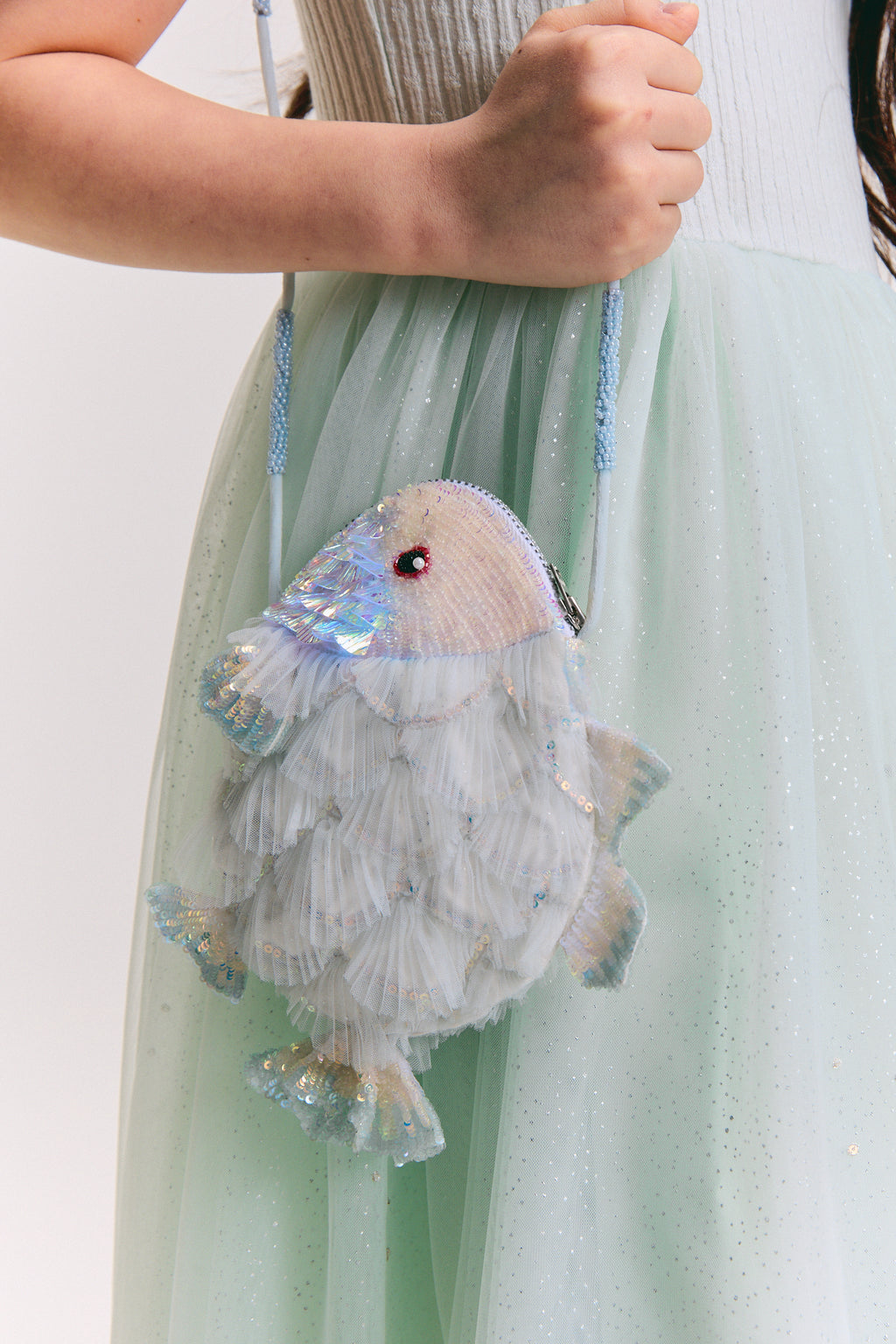 Girls fish-shaped bag with iridescent sequin scales, ruffled tulle and beaded shoulder strap by House of Carousél 