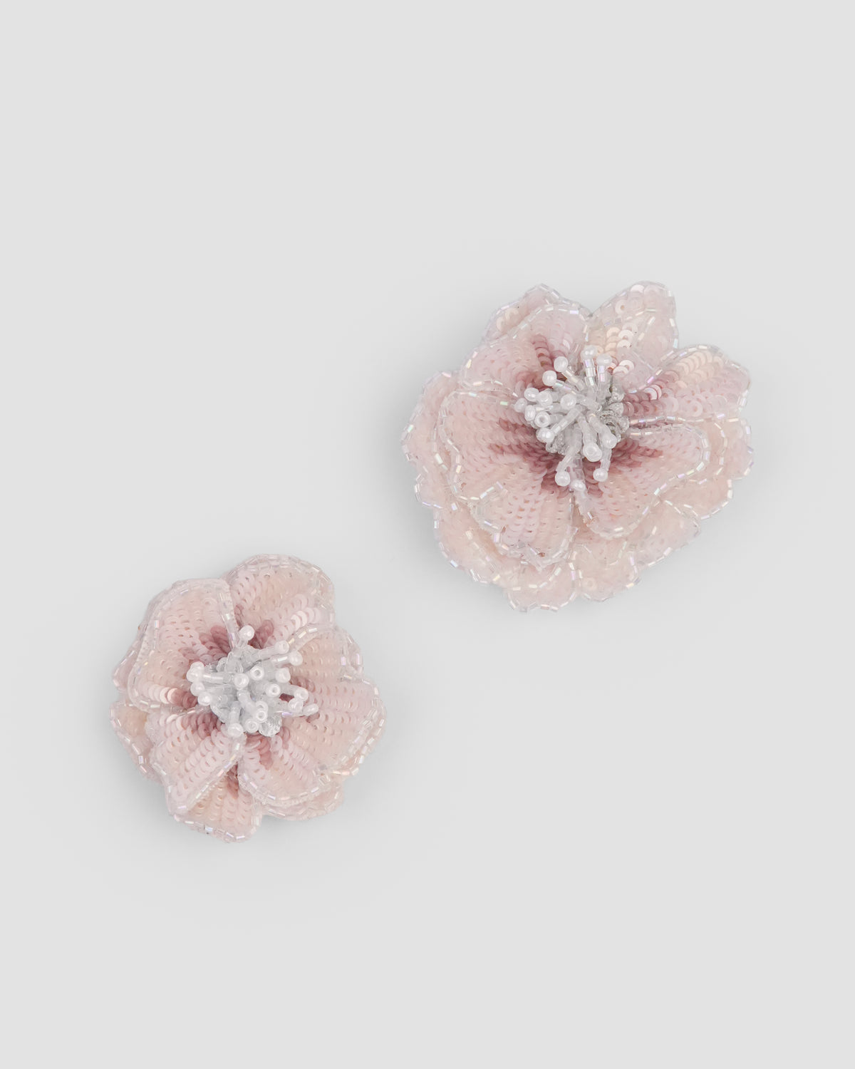 Peach rosette flower hair clips with layered petals and pearl centres by House of Carousél