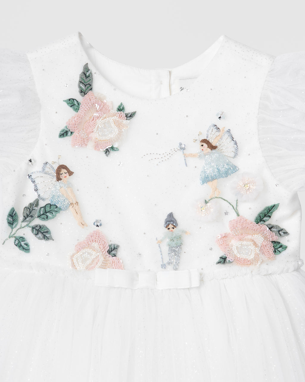 Close-up of fairy, rose and floral embellishments on the Secret Garden of Roses girls dress