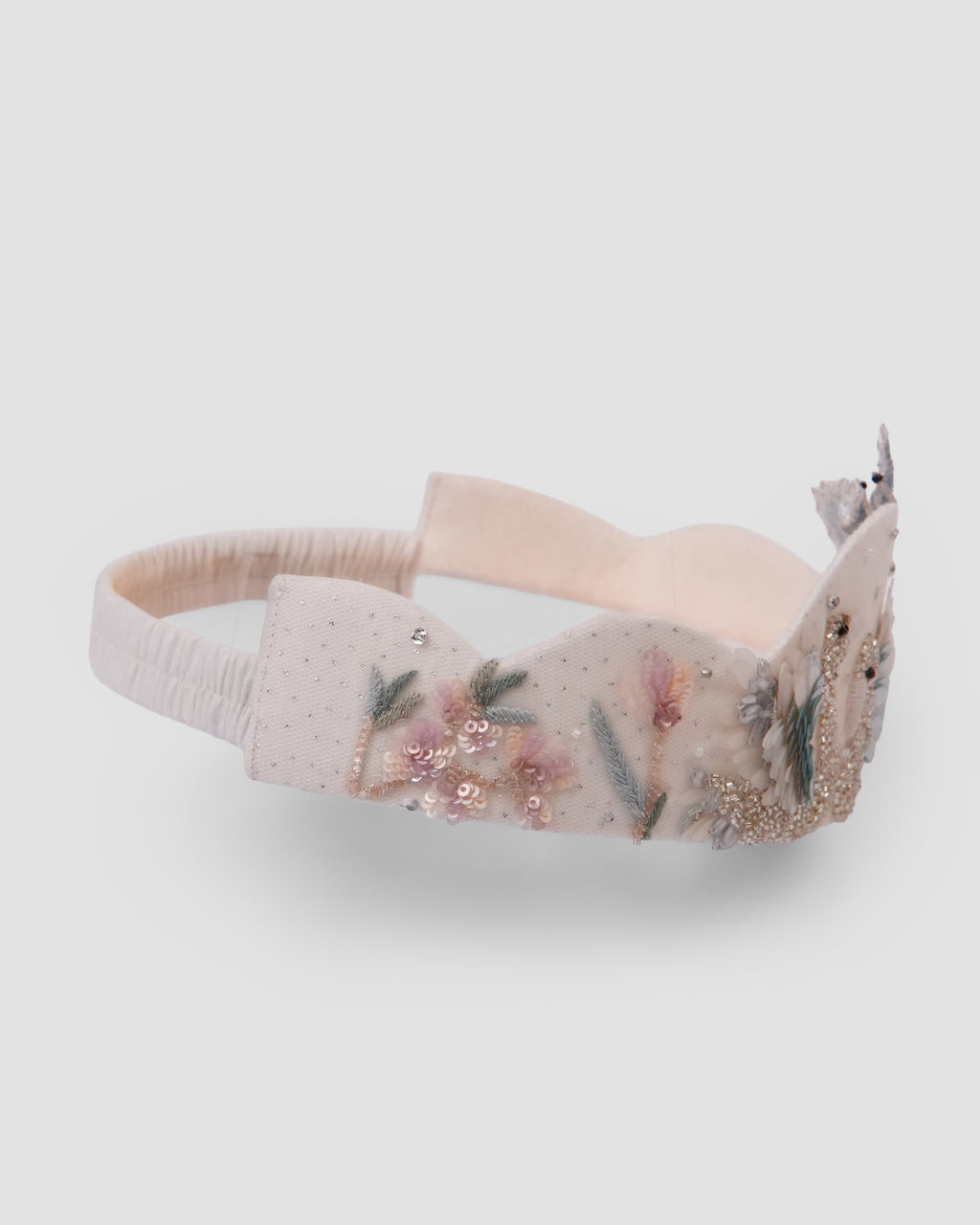 Side view of Swan Crown girls headband with embroidered floral and crystal details by House of Carousél