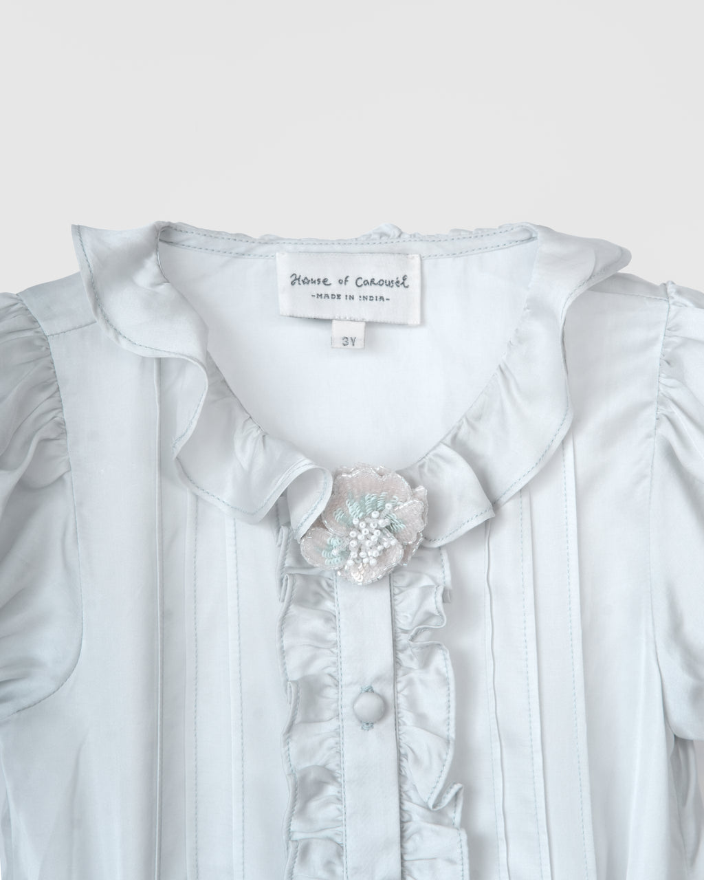 Pale blue ruffled blouse from the Tales of the Bunny Parade Set by House of Carousél