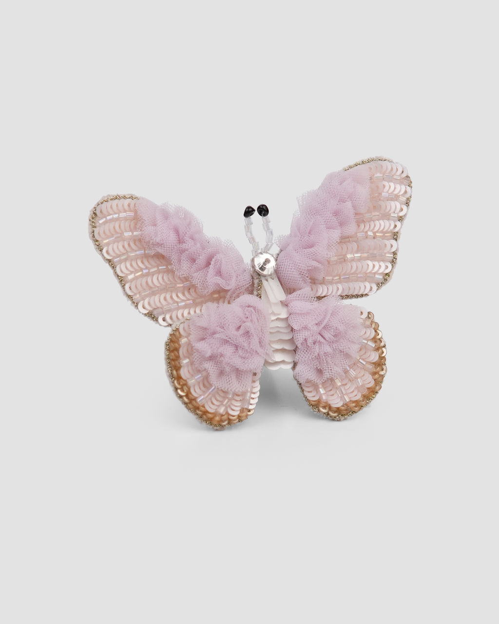 Tulle Flutter butterfly hair clip with lilac ruffled tulle and sequins by House of Carousél available at House of Aura Lebanon