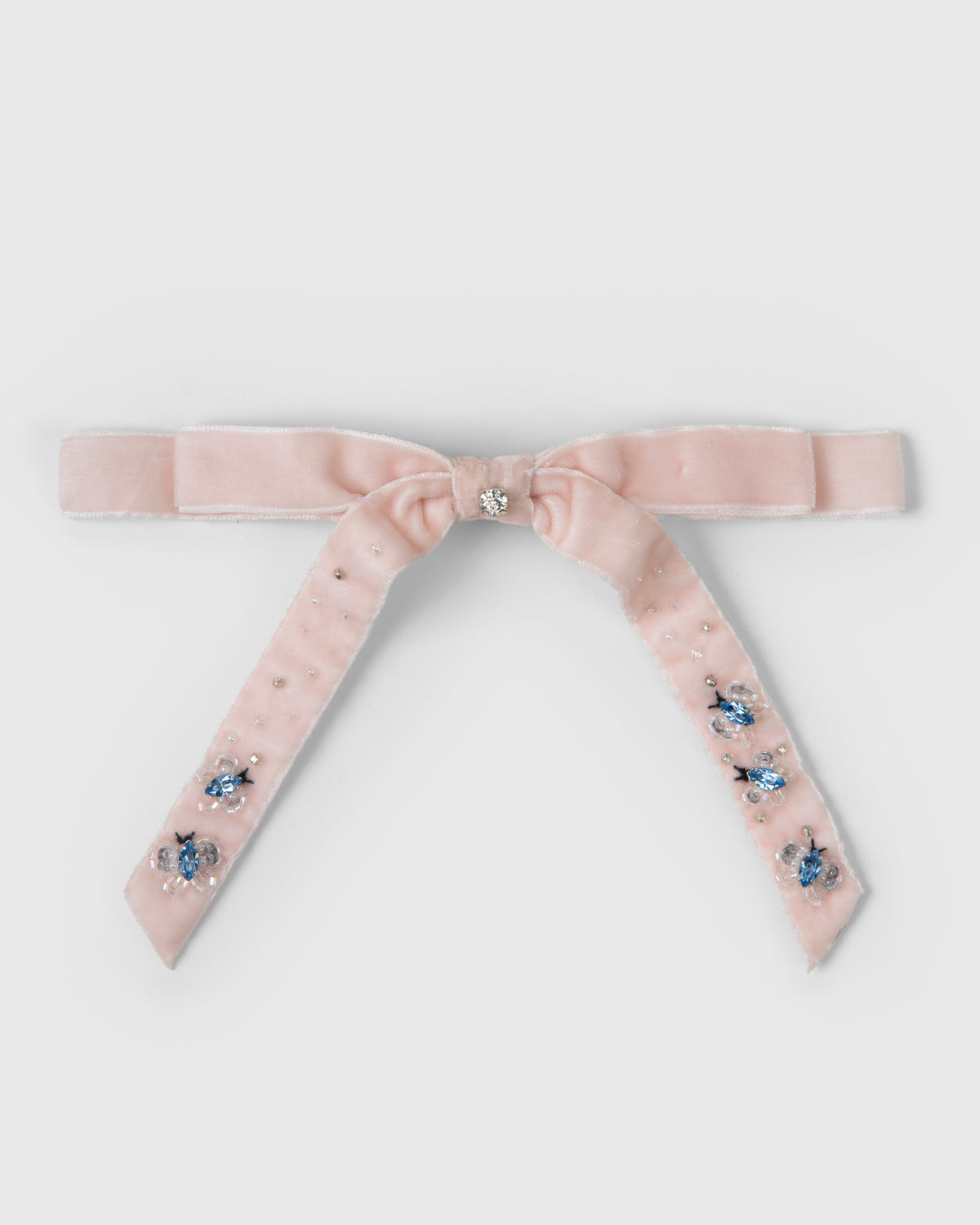 Pink velvet bow hair clip with crystal butterfly embellishments by House of Carousél