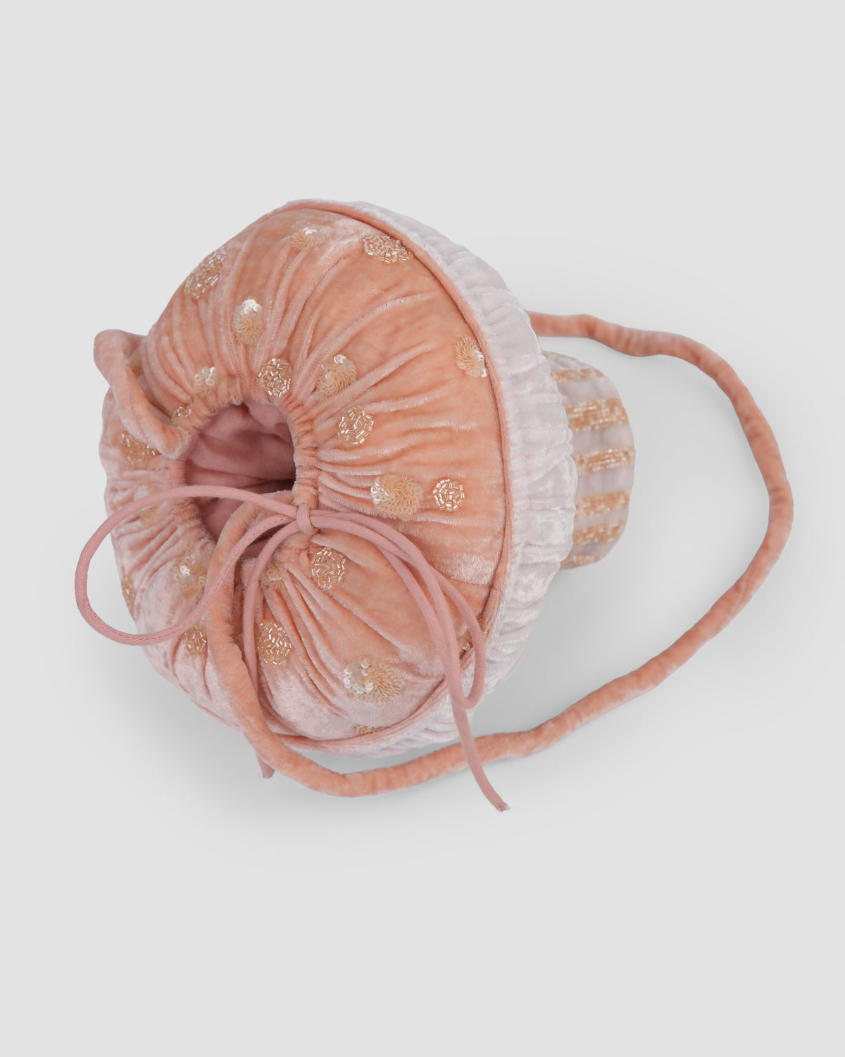 Whimsy Shroom Bag viewed from above, showing the peach velvet drawstring opening and gold floral embroidery by House of Carousél