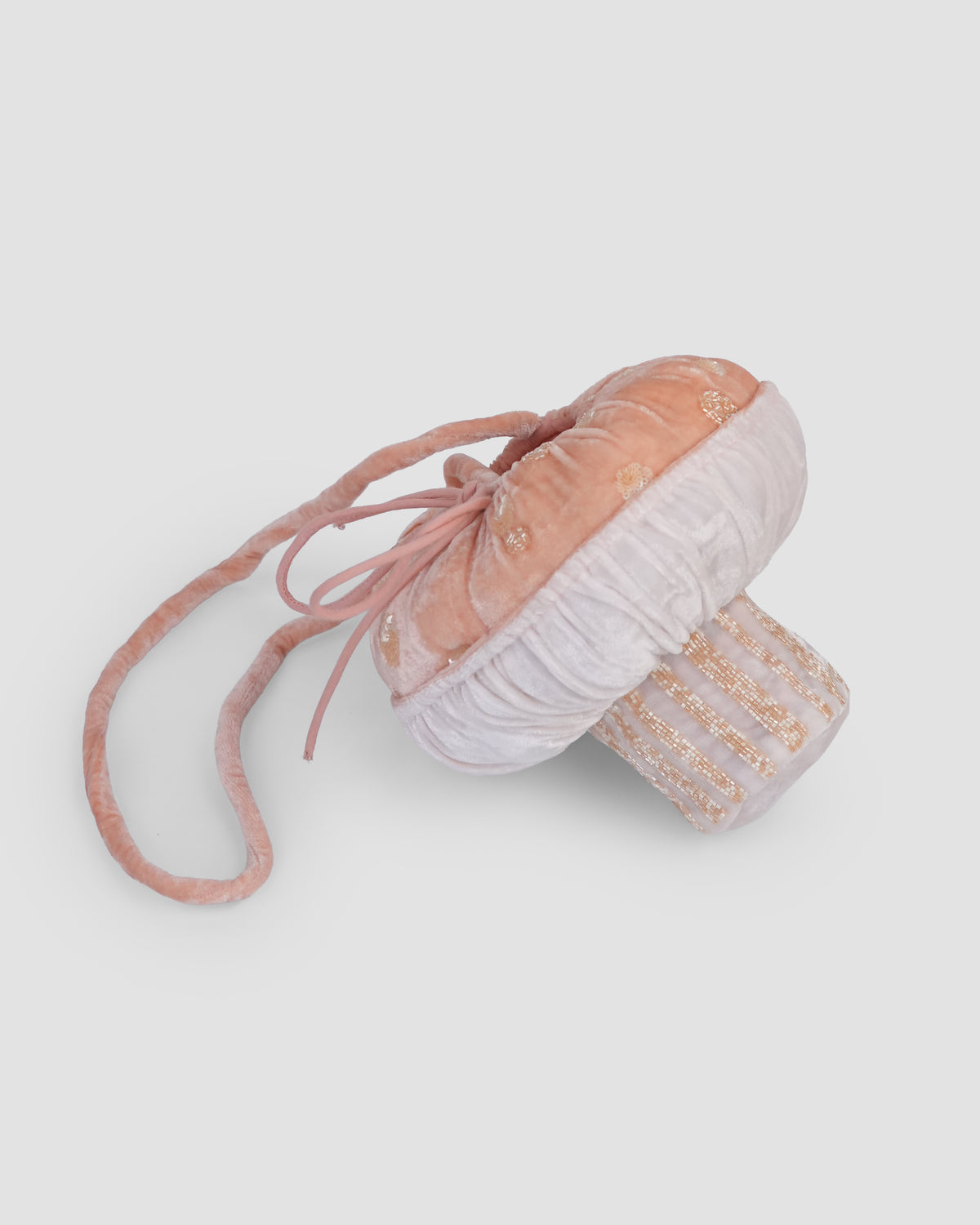 Side view of the Whimsy Shroom Bag with a peach velvet cap, gathered pale underside and gold-beaded stem by House of Carousél