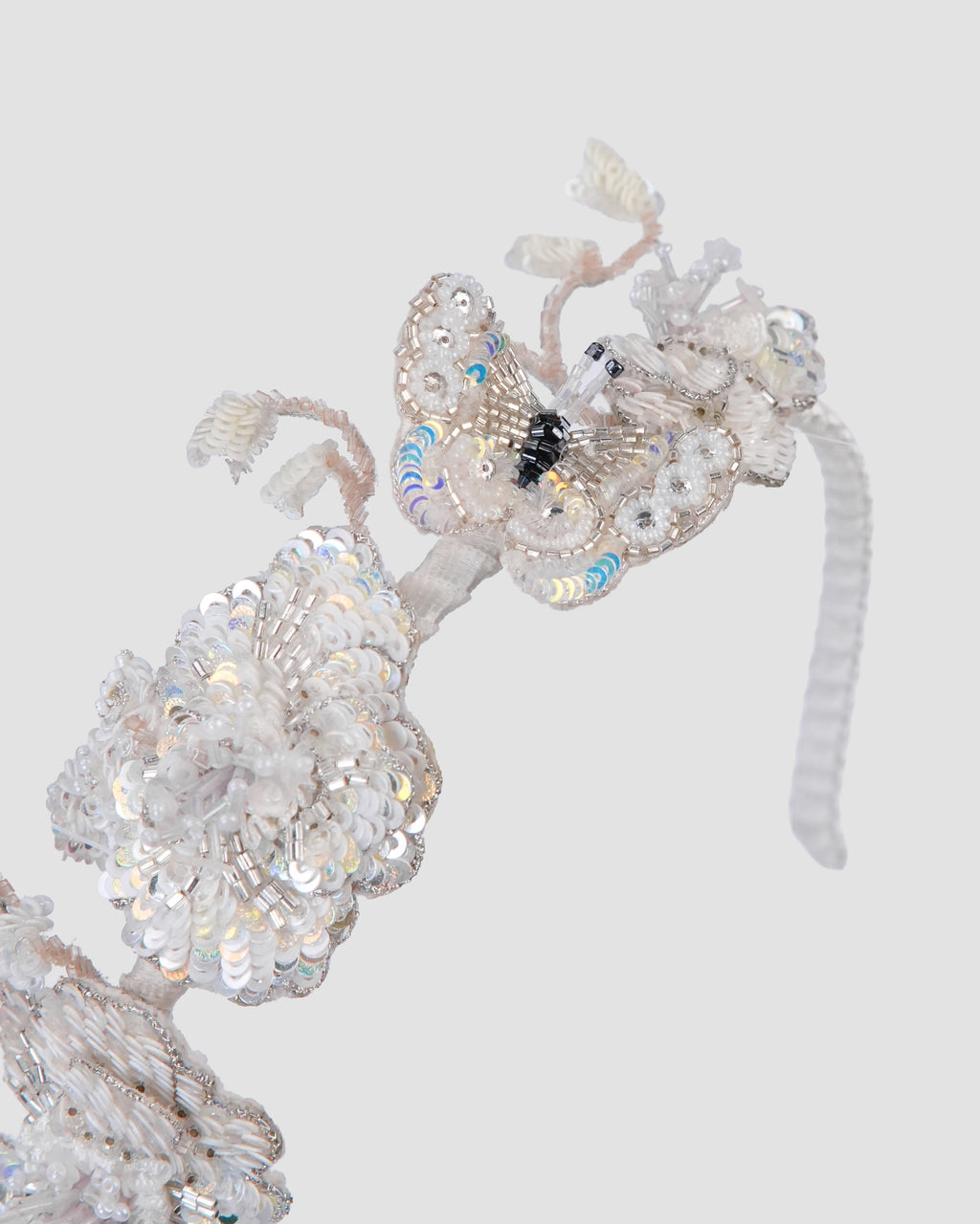 Ivory floral headband for girls with handcrafted flowers, sequins and beaded details by House of Carousél